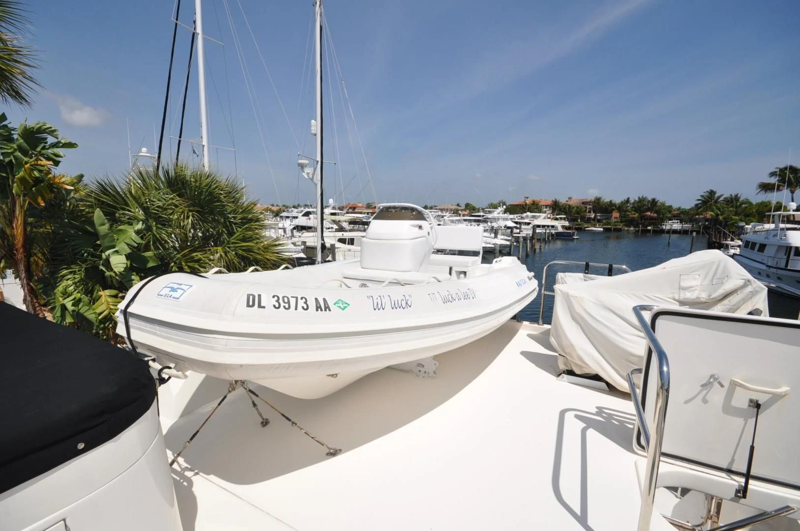 a white boat with blue lettering aboard LUCK A LEE IV Yacht for Sale