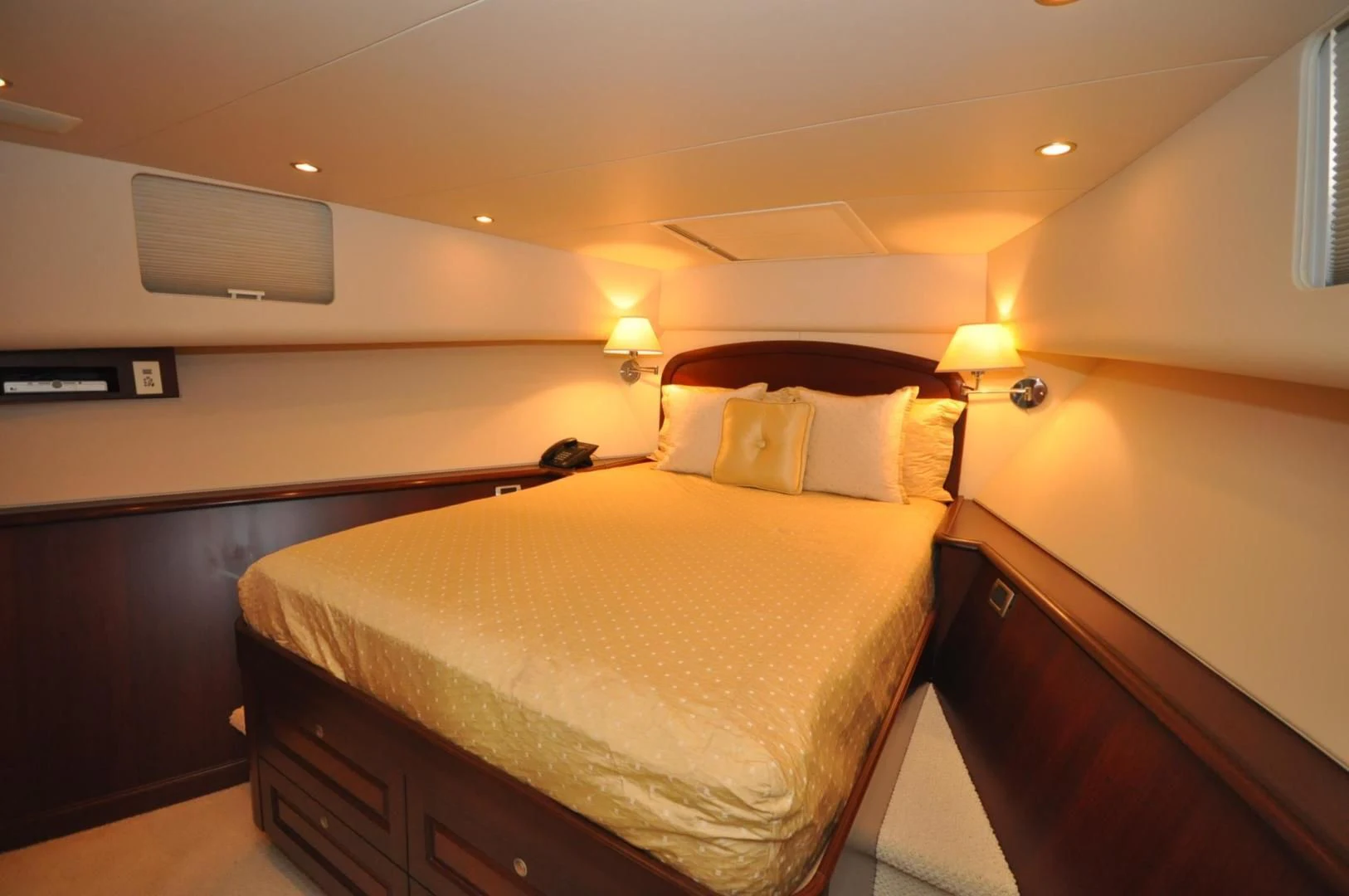 a bedroom with a bed and a desk aboard LUCK A LEE IV Yacht for Sale
