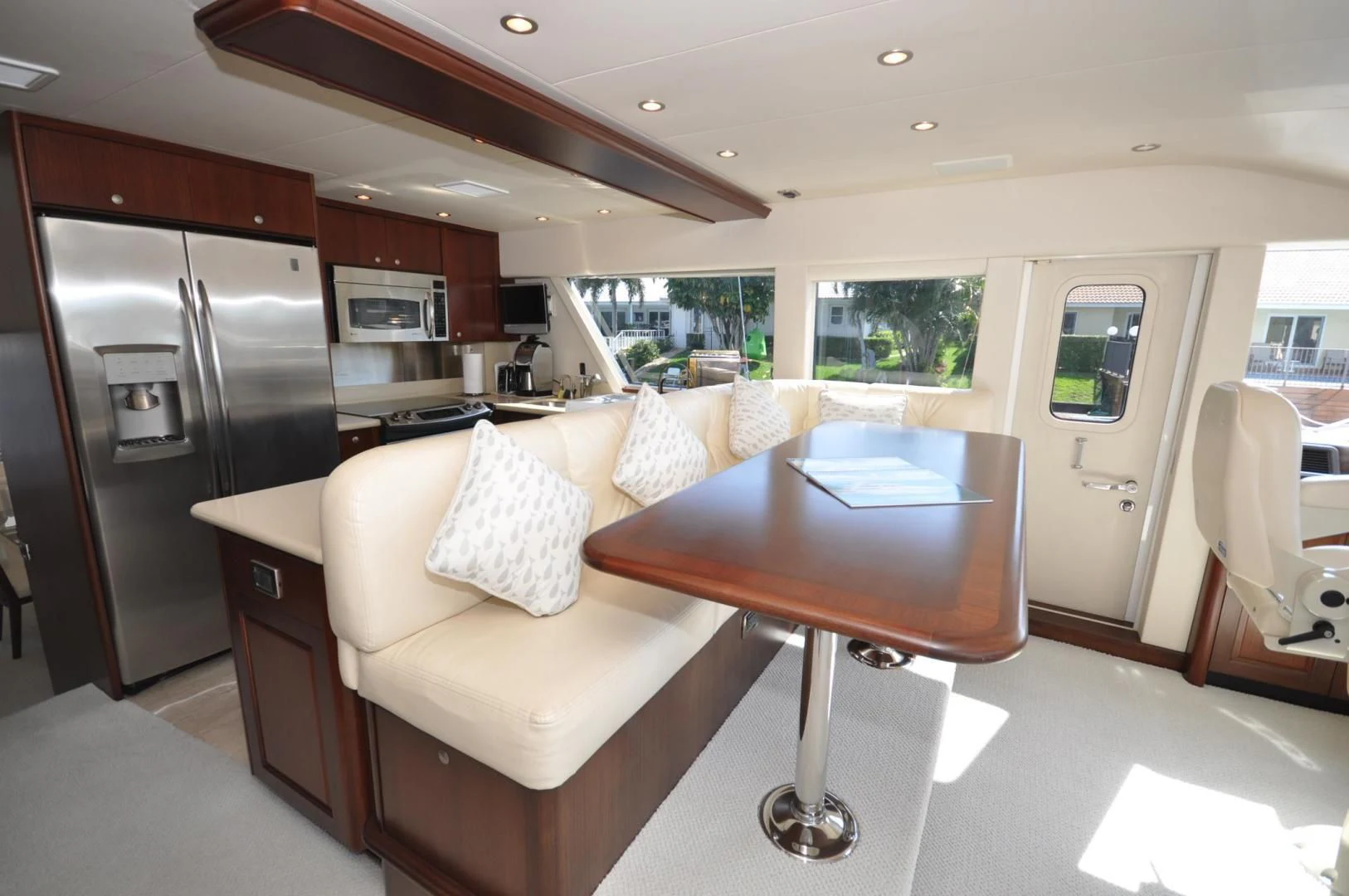 a kitchen with a table and a couch aboard LUCK A LEE IV Yacht for Sale