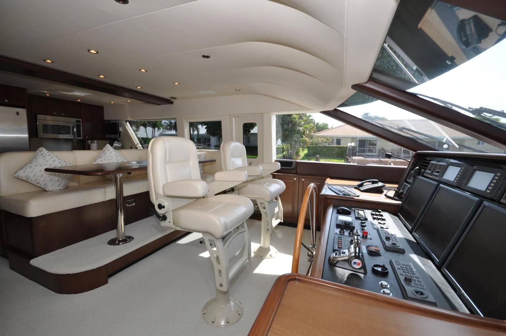 a living room with a desk and a tv aboard LUCK A LEE IV Yacht for Sale