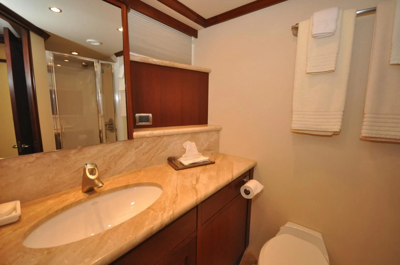 a bathroom with a sink and a mirror aboard LUCK A LEE IV Yacht for Sale
