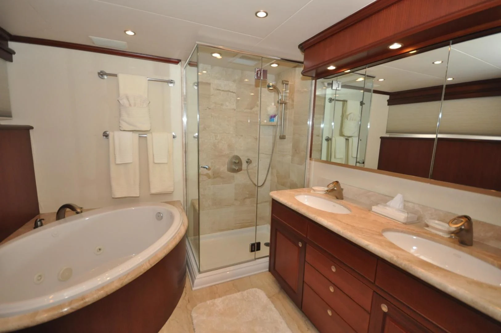 a bathroom with a large mirror aboard LUCK A LEE IV Yacht for Sale