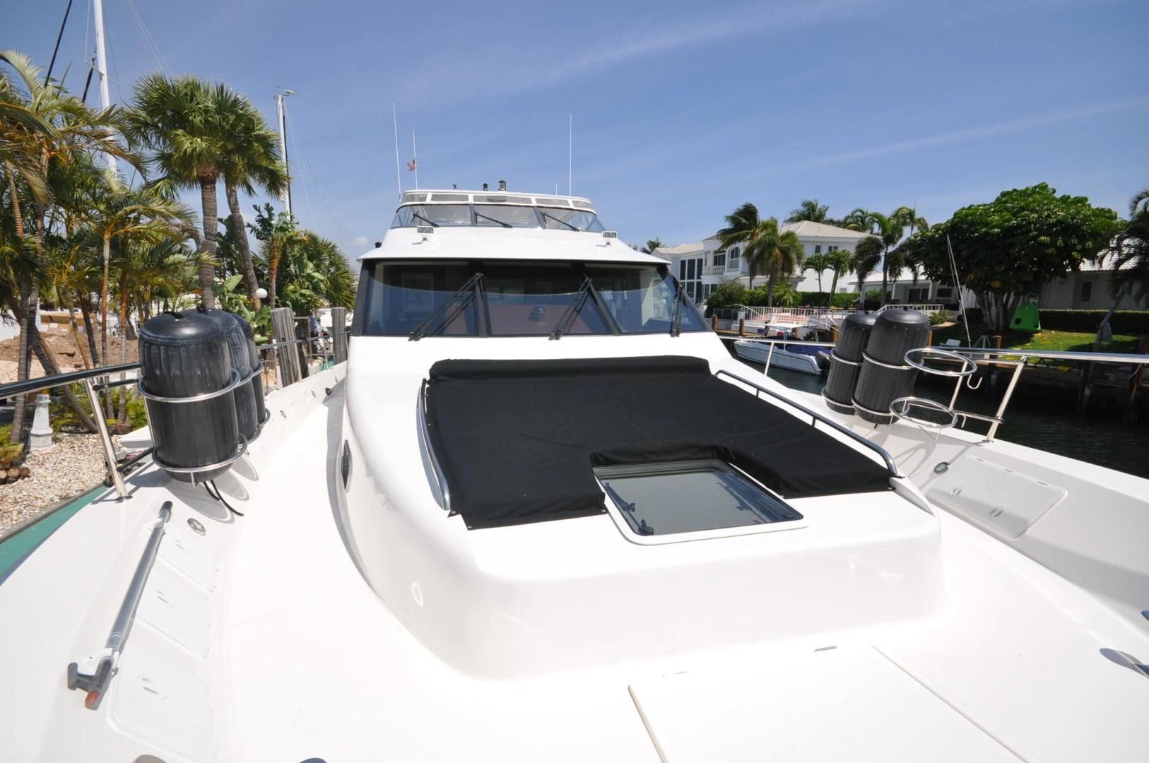 a white yacht docked at a dock aboard LUCK A LEE IV Yacht for Sale