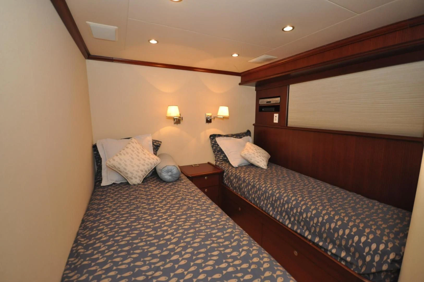 a couple of beds in a hotel room aboard LUCK A LEE IV Yacht for Sale