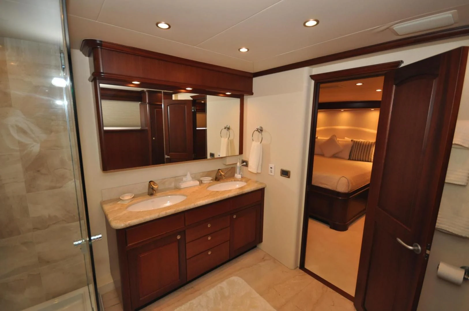 a bathroom with two sinks and a large mirror aboard LUCK A LEE IV Yacht for Sale