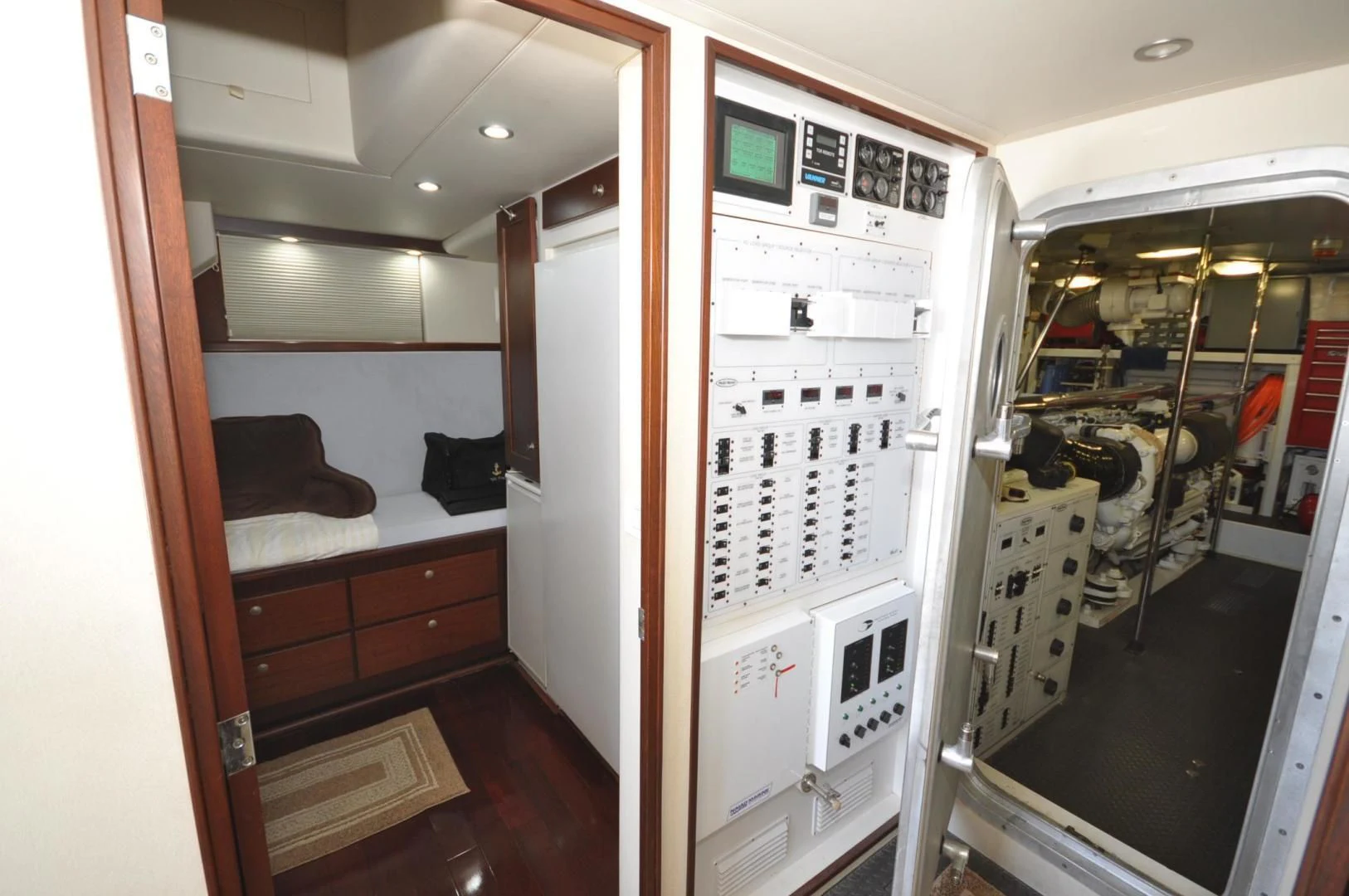 a room with a bed and a desk aboard LUCK A LEE IV Yacht for Sale