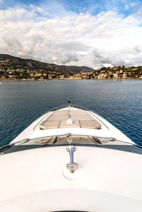 a white boat on the water aboard TAKE OFF Yacht for Sale