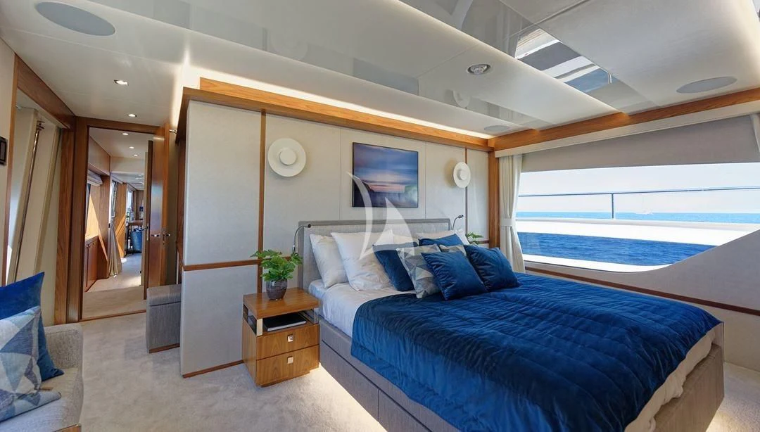 a bedroom with a large bed aboard TAKE OFF Yacht for Sale