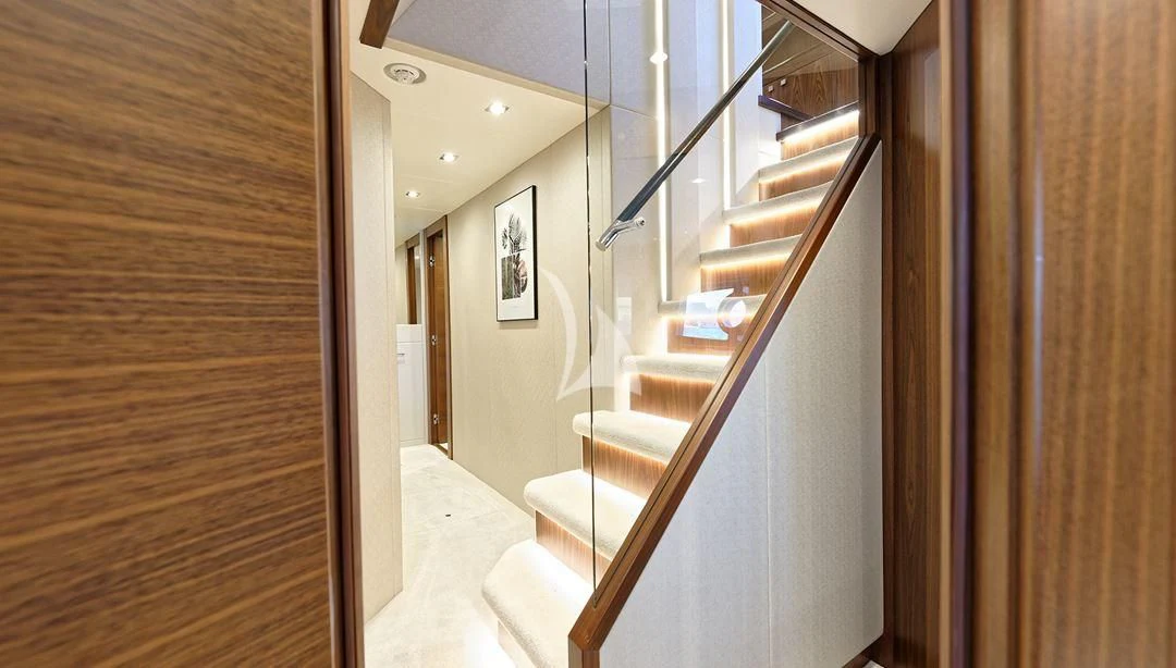a hallway with a door and a staircase aboard TAKE OFF Yacht for Sale