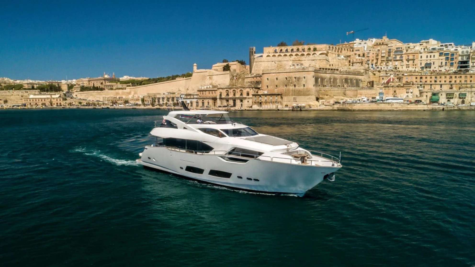 a white yacht on the water aboard TAKE OFF Yacht for Sale