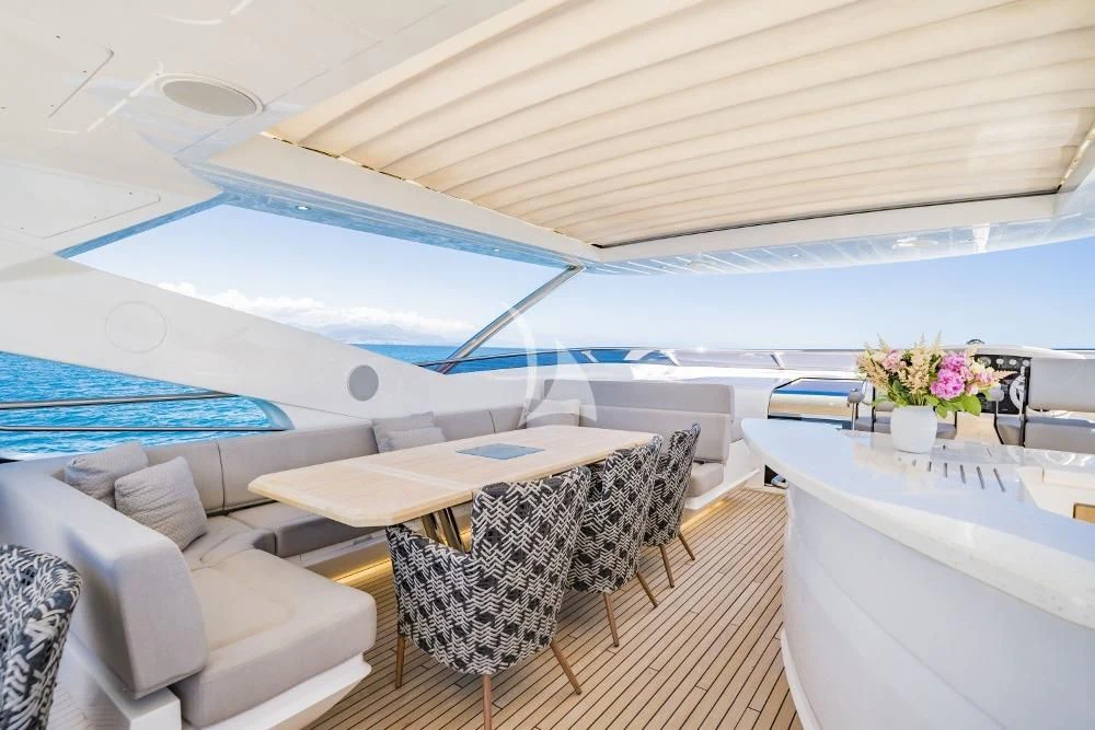 a room with a table and chairs aboard TAKE OFF Yacht for Sale