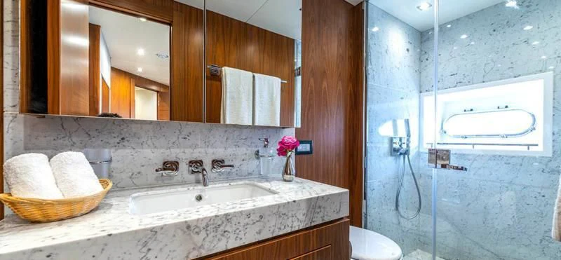 a bathroom with a sink and a mirror aboard TAKE OFF Yacht for Sale