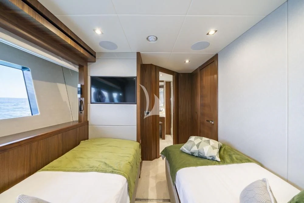 a room with two beds aboard TAKE OFF Yacht for Sale