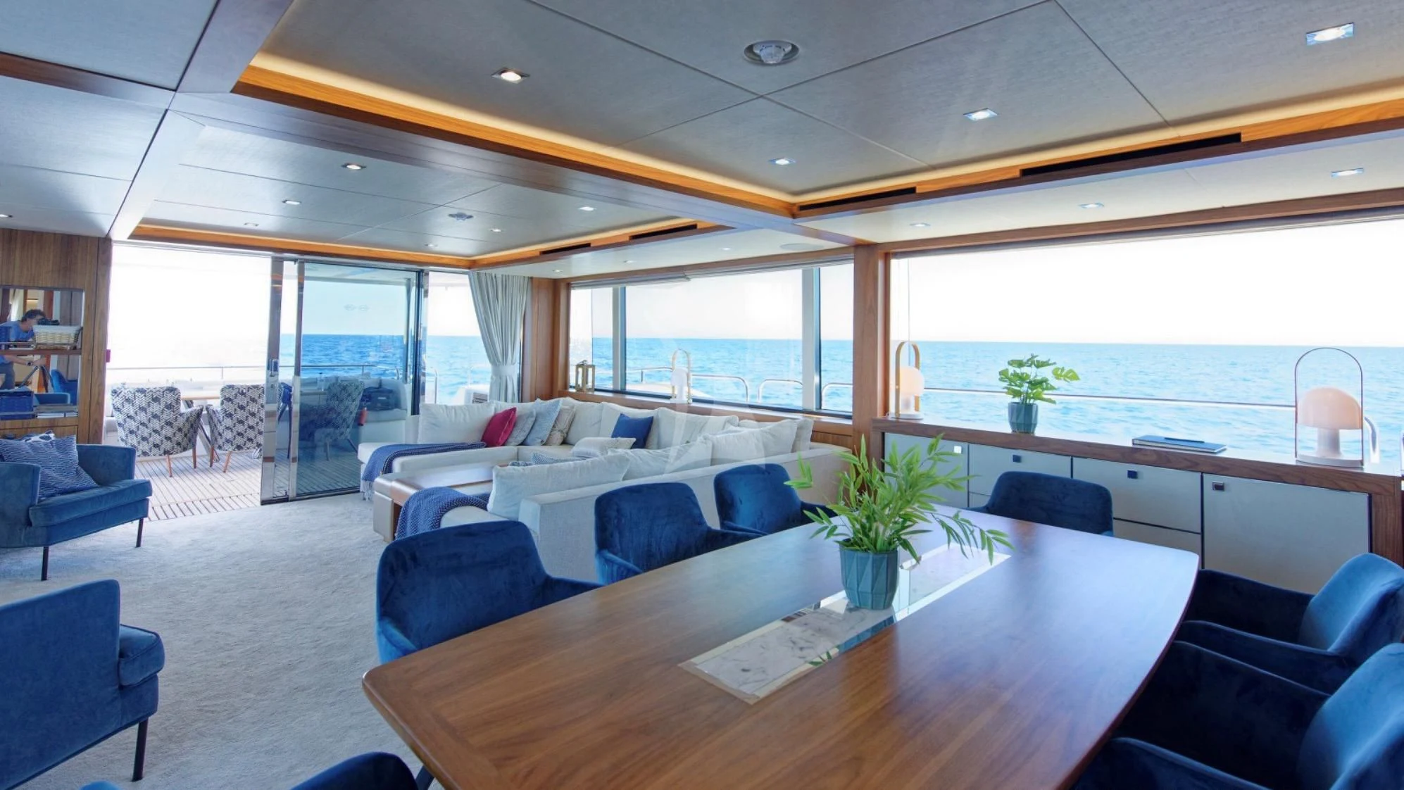a room with a table chairs and a large window aboard TAKE OFF Yacht for Sale