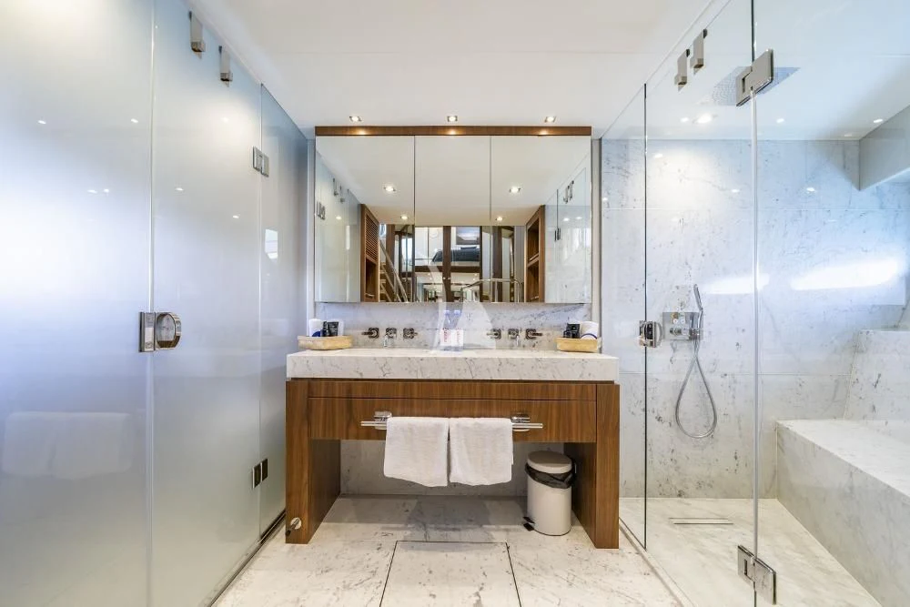 a bathroom with a glass shower aboard TAKE OFF Yacht for Sale