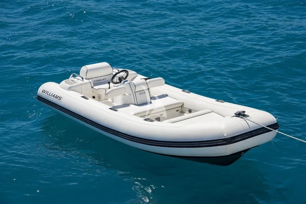 a white boat in the water aboard TAKE OFF Yacht for Sale