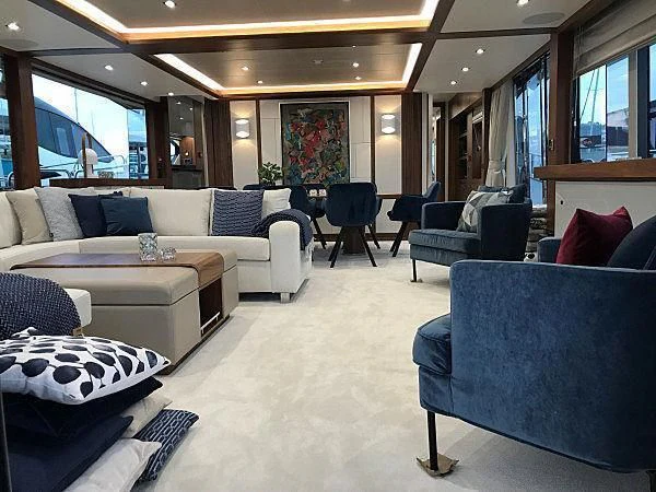 a living room with a couch and a table aboard TAKE OFF Yacht for Sale