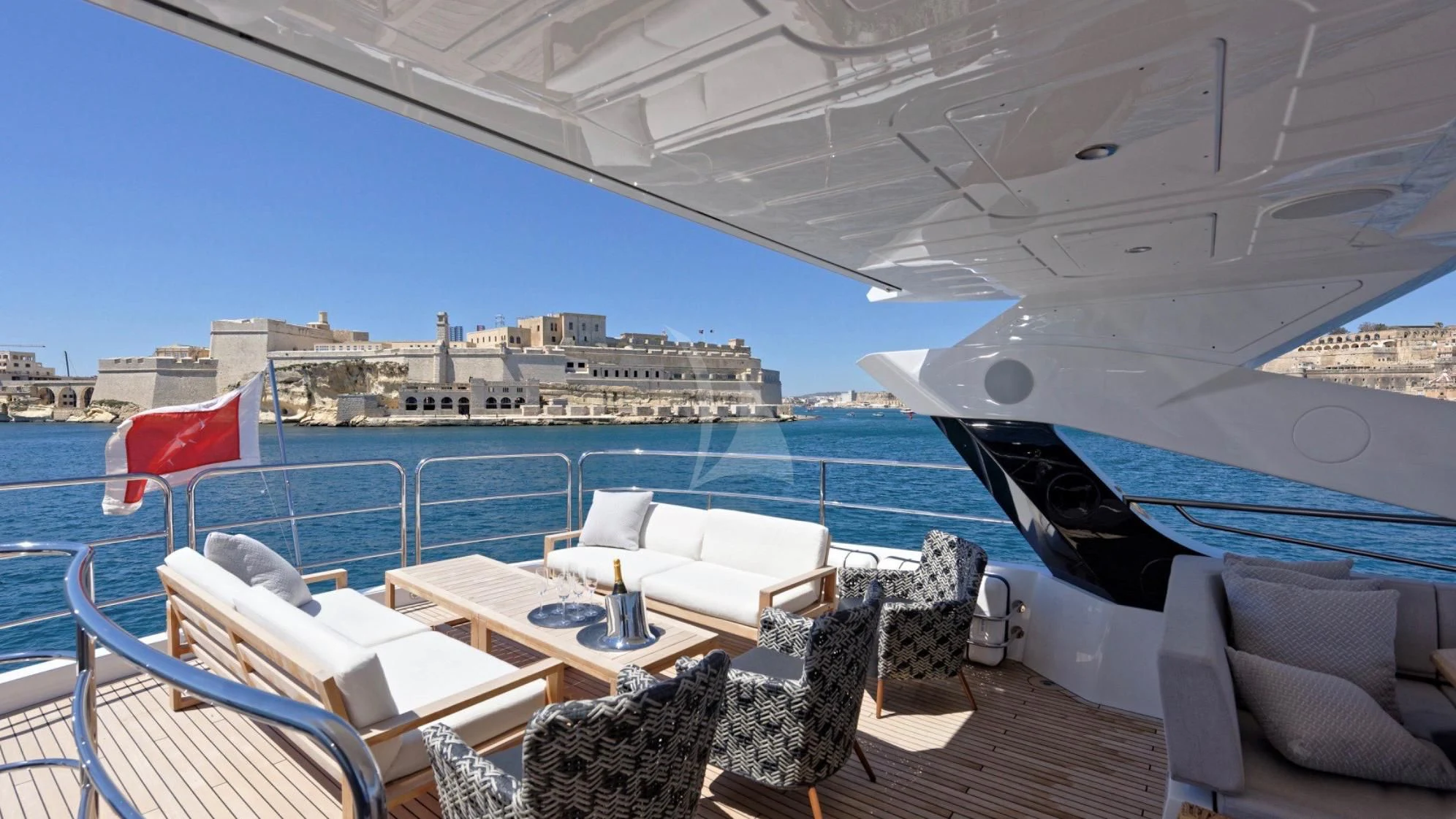 a deck with chairs and tables on it aboard TAKE OFF Yacht for Sale