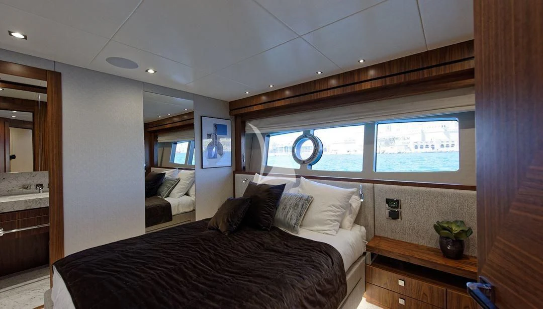 a bedroom with a large bed aboard TAKE OFF Yacht for Sale