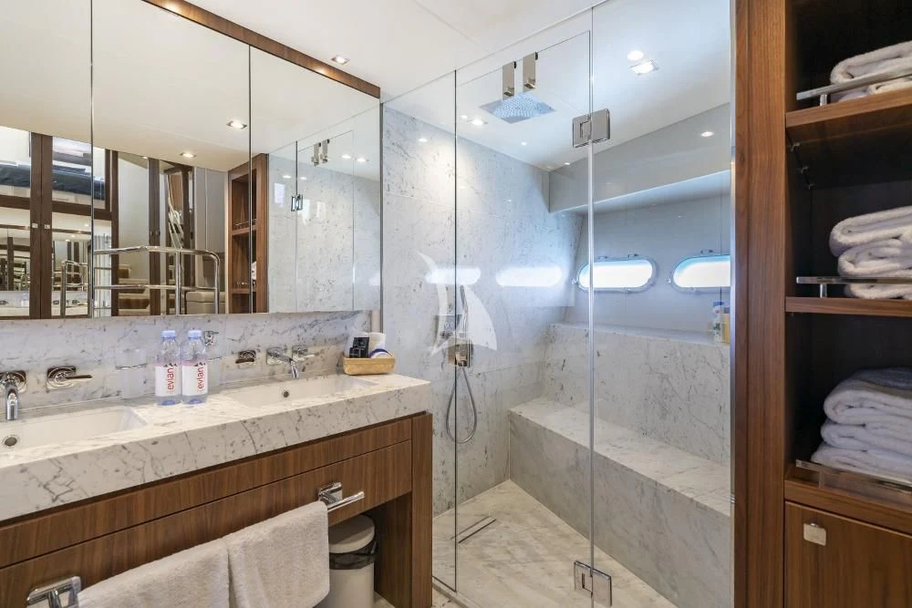 a bathroom with a shower unit and sink aboard TAKE OFF Yacht for Sale