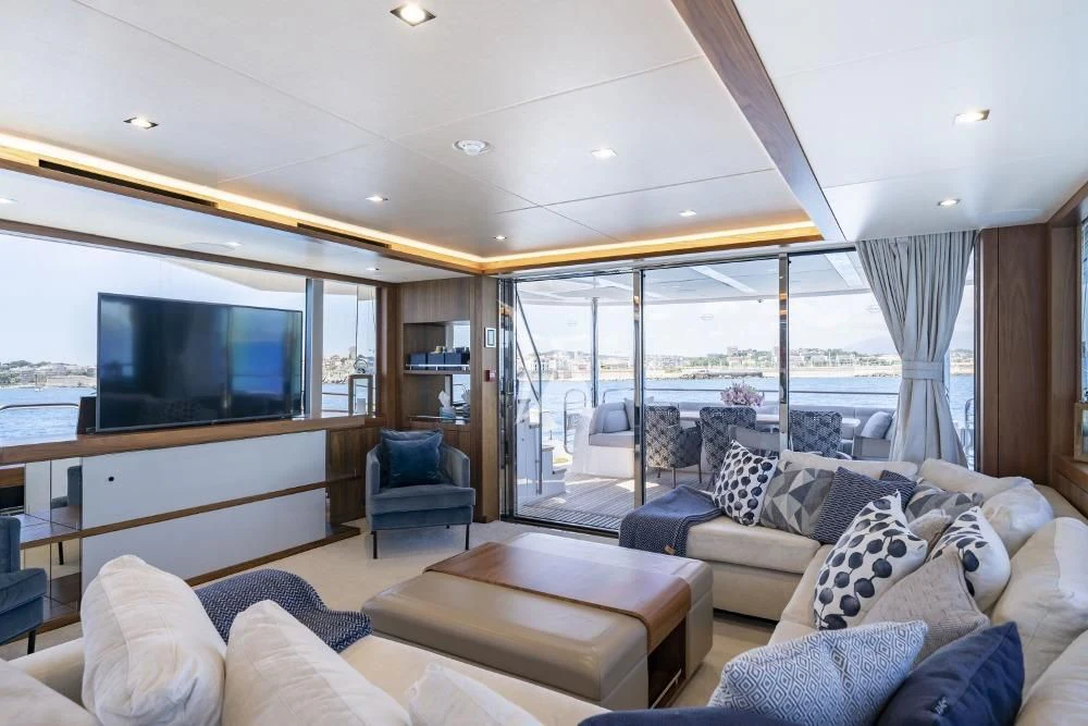 a living room with a large glass window aboard TAKE OFF Yacht for Sale