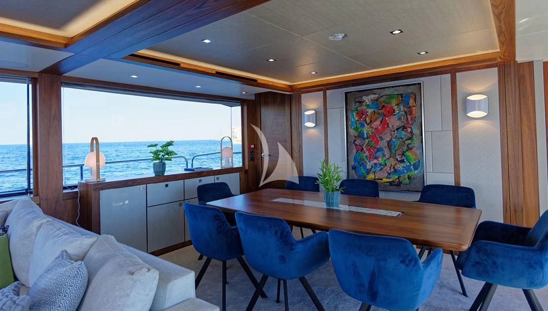 a room with a table and chairs aboard TAKE OFF Yacht for Sale