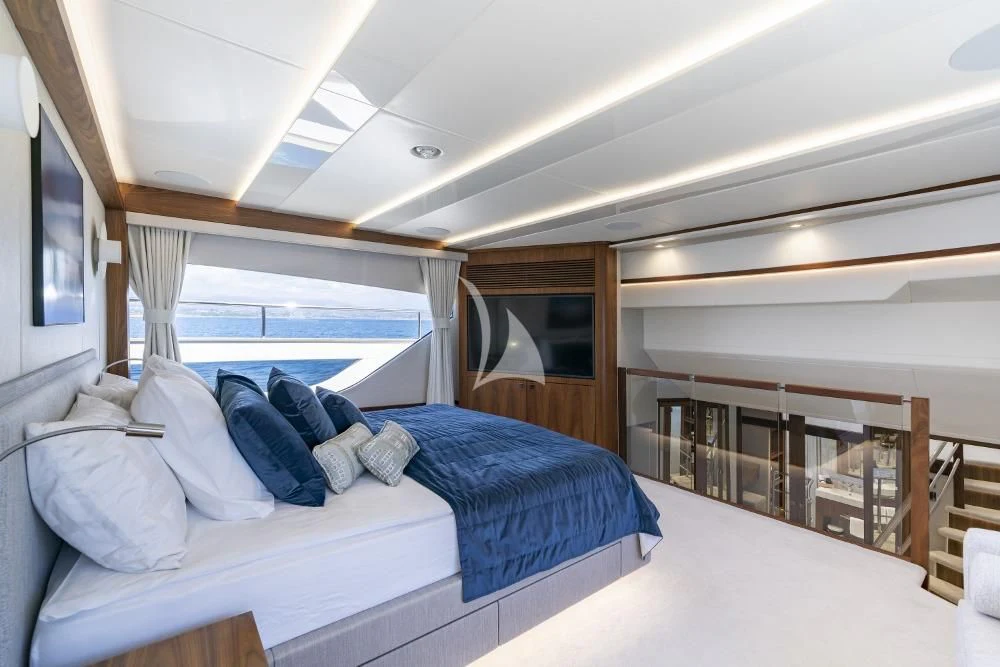 a room with a bed and a view of the ocean aboard TAKE OFF Yacht for Sale
