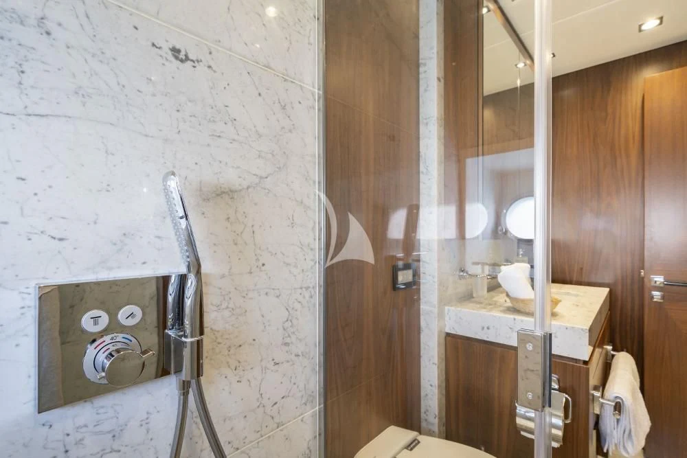 a bathroom with a sink and a mirror aboard TAKE OFF Yacht for Sale