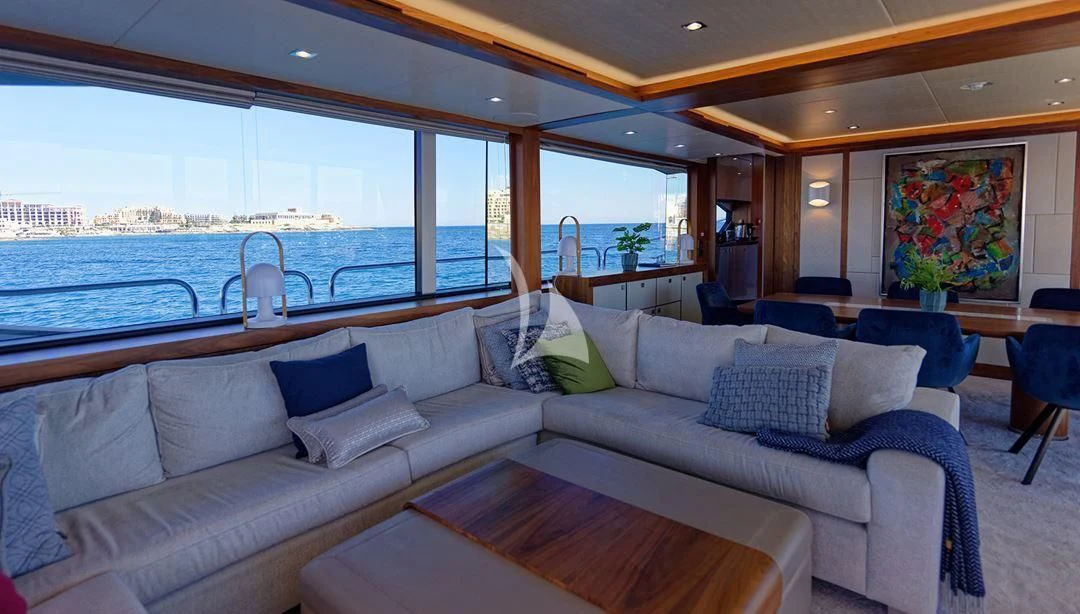 a living room with a large window aboard TAKE OFF Yacht for Sale