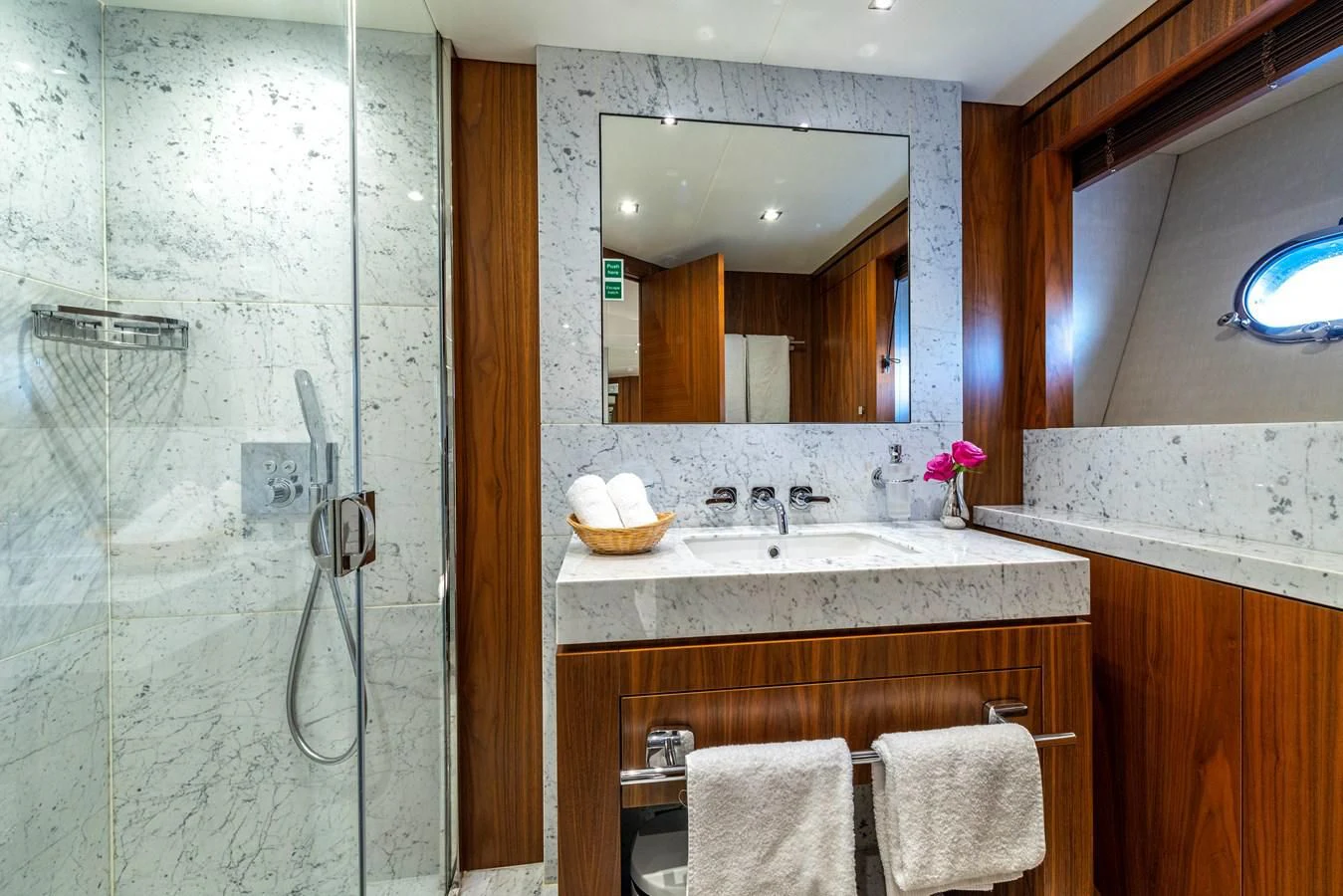 a bathroom with a sink and a mirror aboard TAKE OFF Yacht for Sale