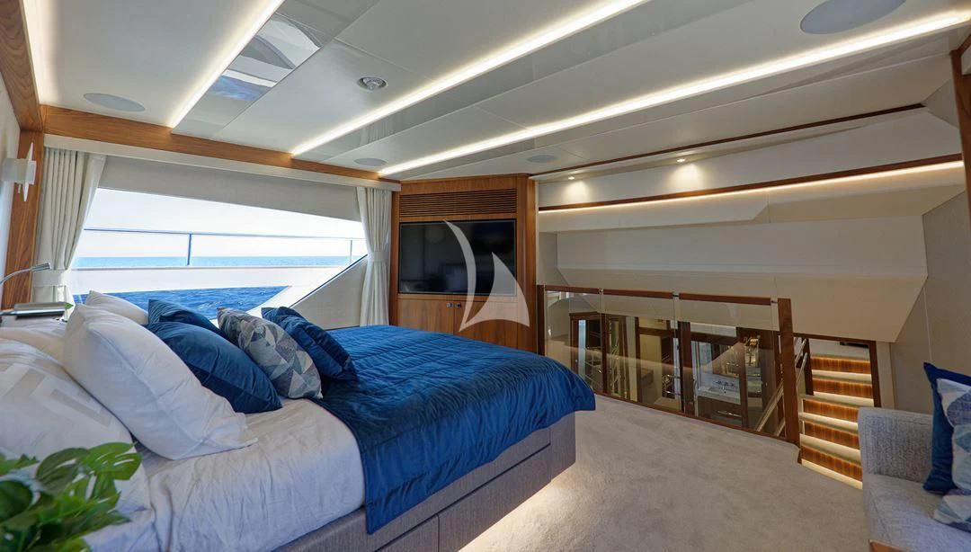 a room with a bed and a window aboard TAKE OFF Yacht for Sale