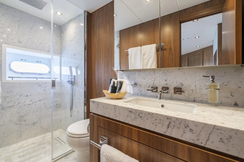 a bathroom with a large mirror aboard TAKE OFF Yacht for Sale