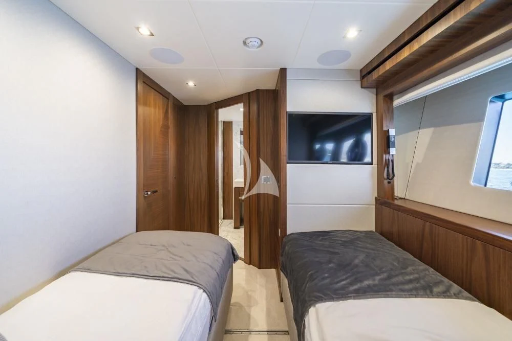 a room with a bed and a television aboard TAKE OFF Yacht for Sale