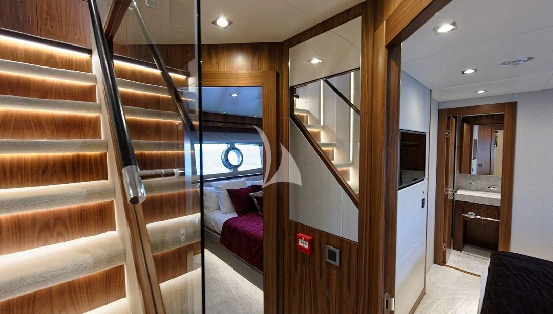 a room with wooden stairs aboard TAKE OFF Yacht for Sale