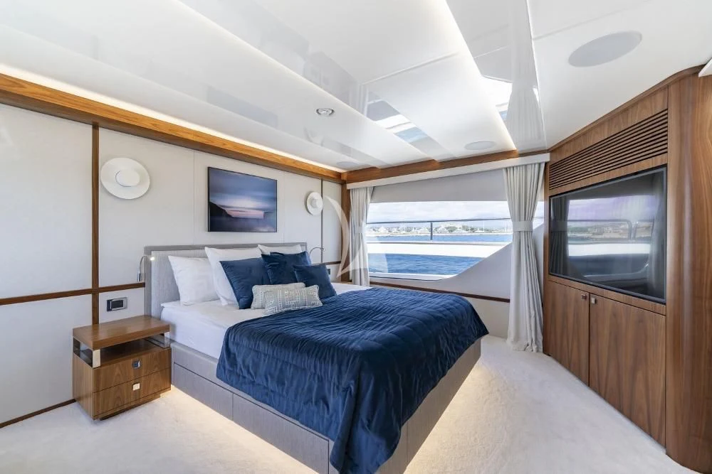 a room with a bed and a television aboard TAKE OFF Yacht for Sale