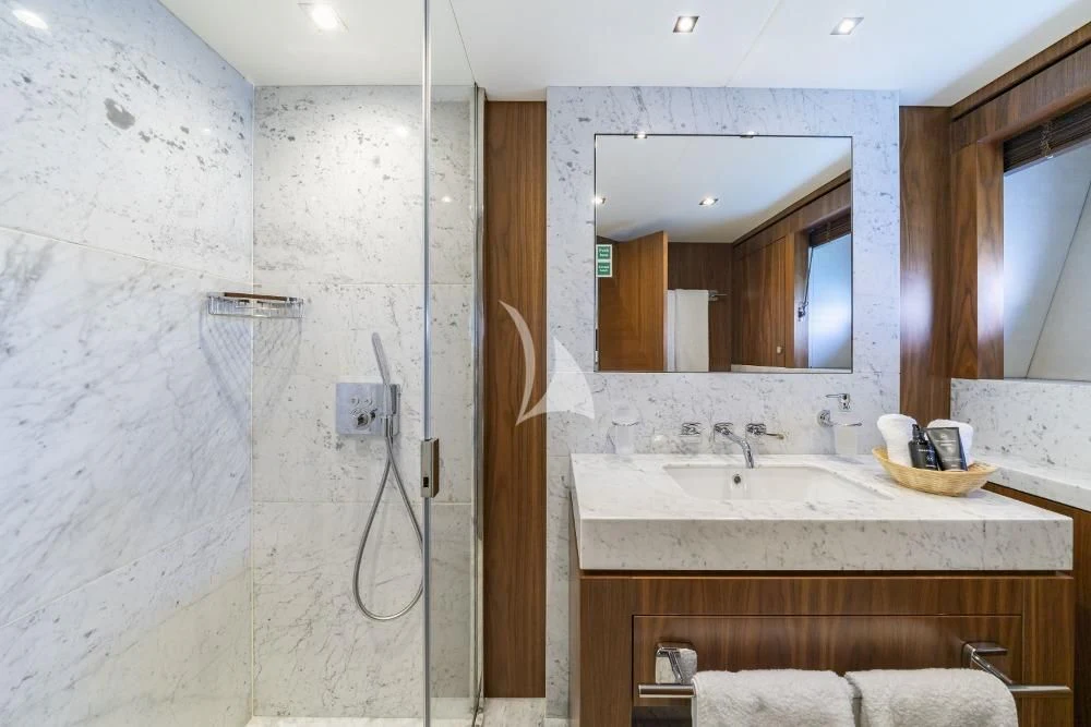 a bathroom with a sink and a mirror aboard TAKE OFF Yacht for Sale