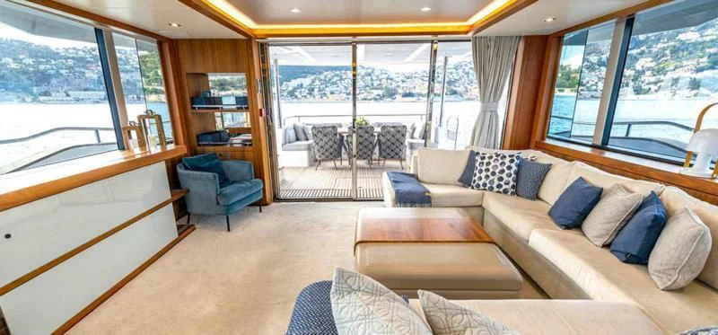 a living room with a large window aboard TAKE OFF Yacht for Sale