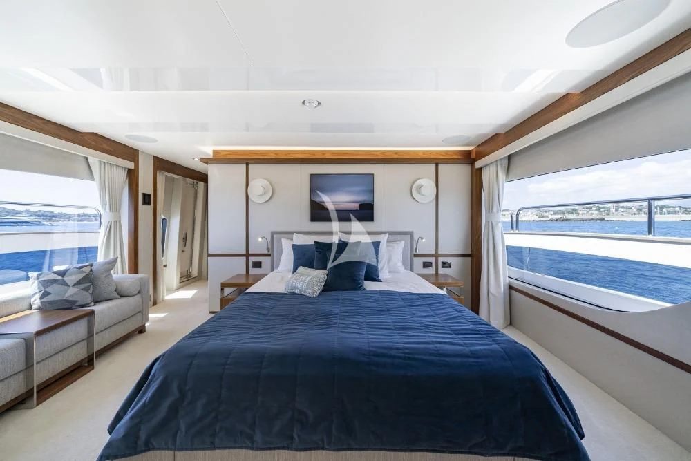 a bedroom with a large bed aboard TAKE OFF Yacht for Sale