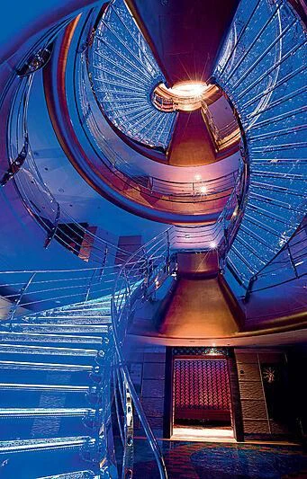 a spiral staircase with a spiral staircase aboard SCENIC ECLIPSE Yacht for Sale