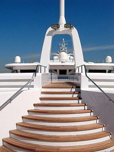 a white building with stairs aboard SCENIC ECLIPSE Yacht for Sale