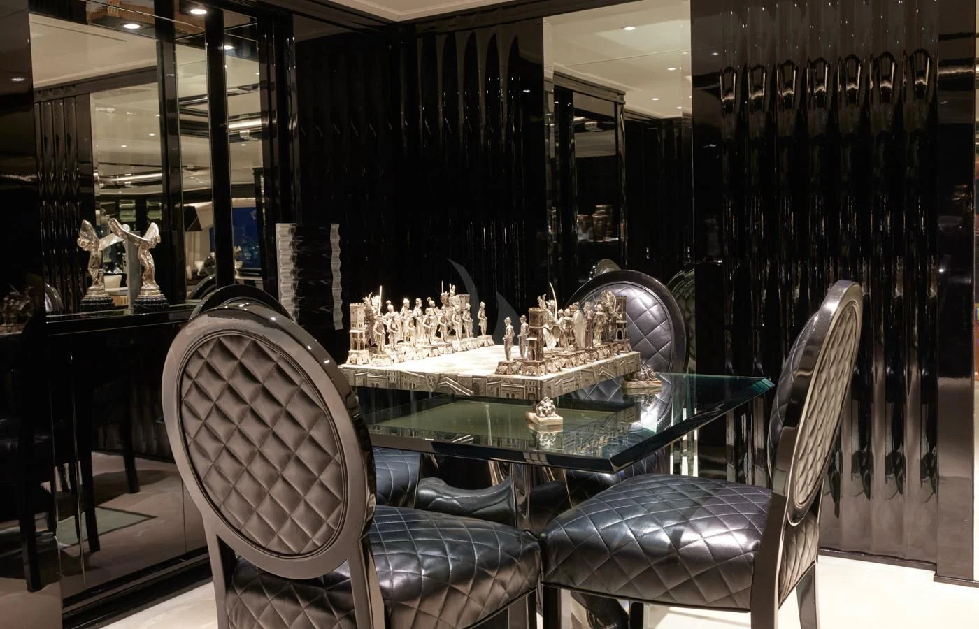 a room with a table and chairs aboard SILVER ANGEL Yacht for Charter