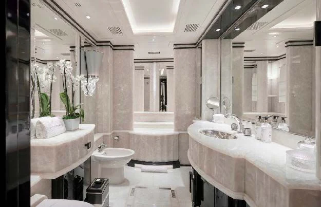 a bathroom with a sink toilet and bathtub aboard SILVER ANGEL Yacht for Charter