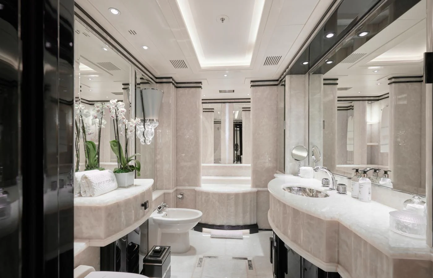 a bathroom with a large mirror aboard SILVER ANGEL Yacht for Charter