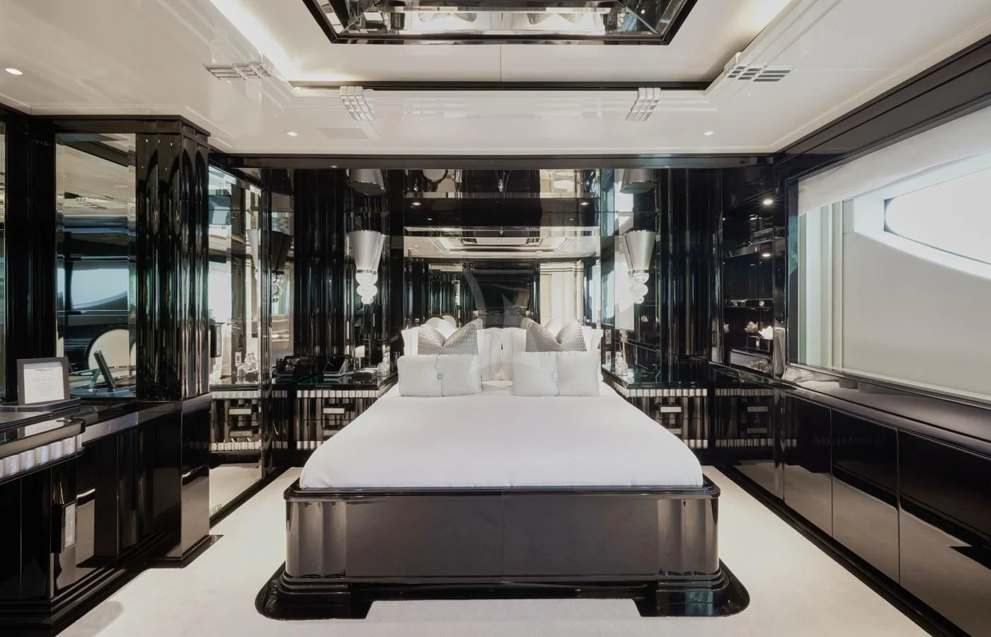a room with a bed and a desk aboard SILVER ANGEL Yacht for Charter