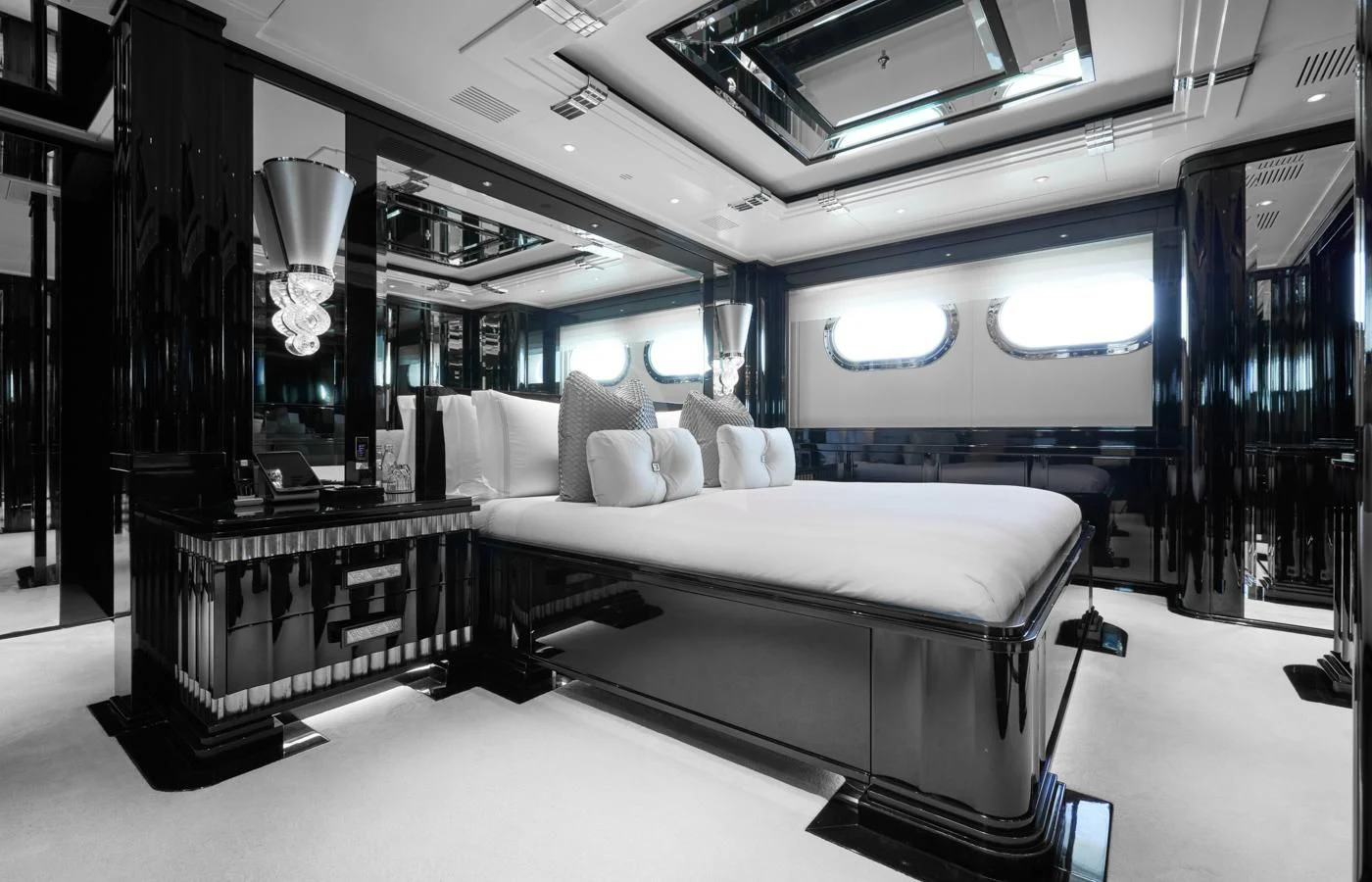 a room with a bed and a table aboard SILVER ANGEL Yacht for Charter