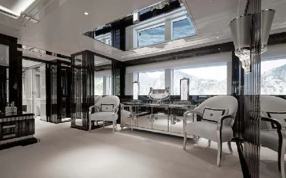 a room with a table chairs and a window aboard SILVER ANGEL Yacht for Charter