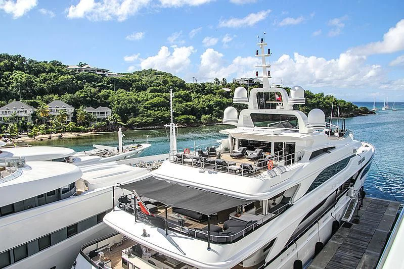 a boat docked at a pier aboard SILVER ANGEL Yacht for Charter