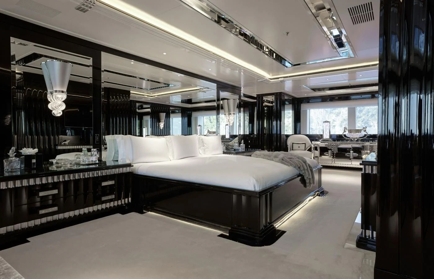 a room with a bed and a table aboard SILVER ANGEL Yacht for Charter