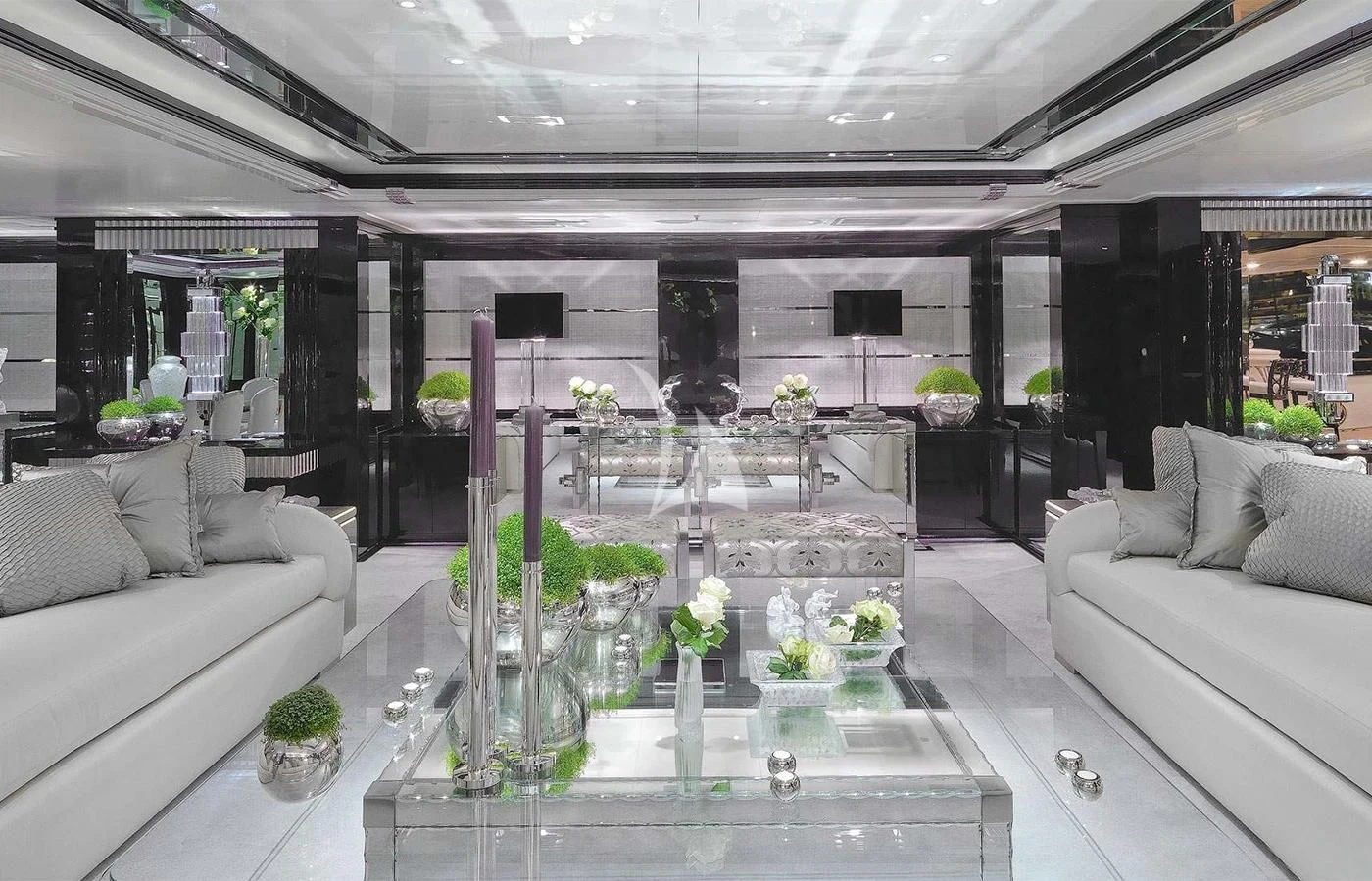 a large room with a table and chairs aboard SILVER ANGEL Yacht for Charter