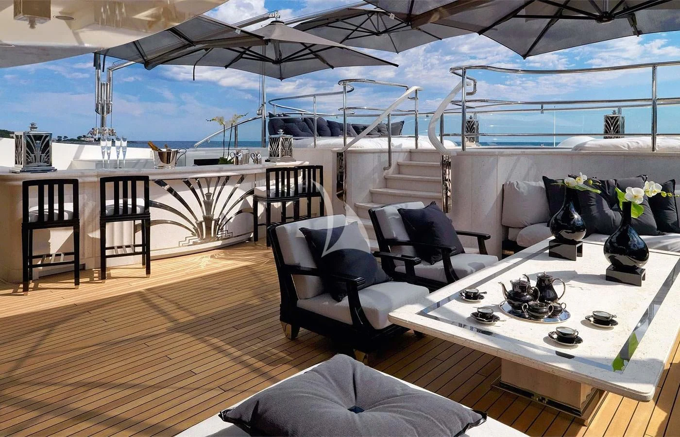 a room with a large table and chairs and a large window aboard SILVER ANGEL Yacht for Charter